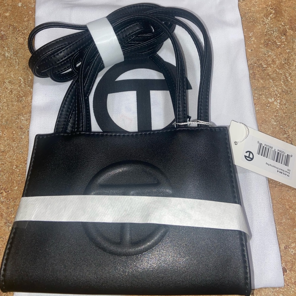 Black Mini Telfar bag.